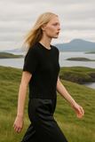 Wool sweater with short raglan sleeves, round neck, and ribbed cuffs, featuring a relaxed fit.